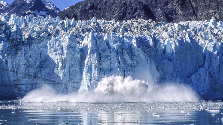 glacier calving into ocean