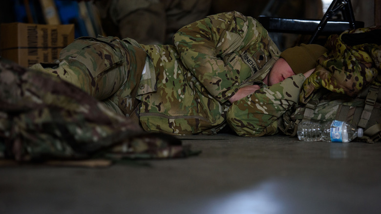 Soldier sleeping on the ground