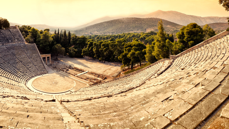 ancient amphitheater and distant mountains