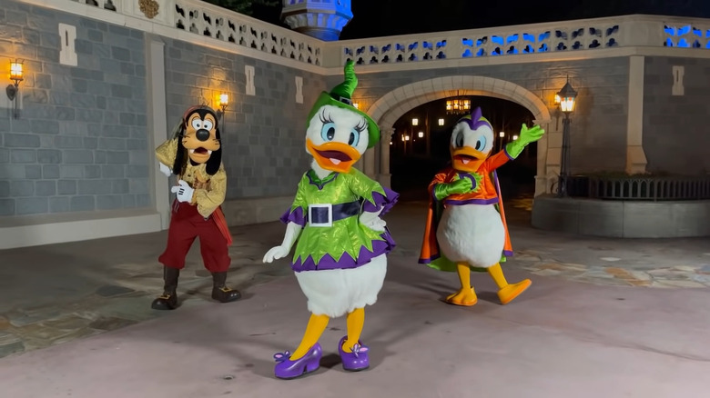 Goofy, Daisy Duck, and Donald Duck posing