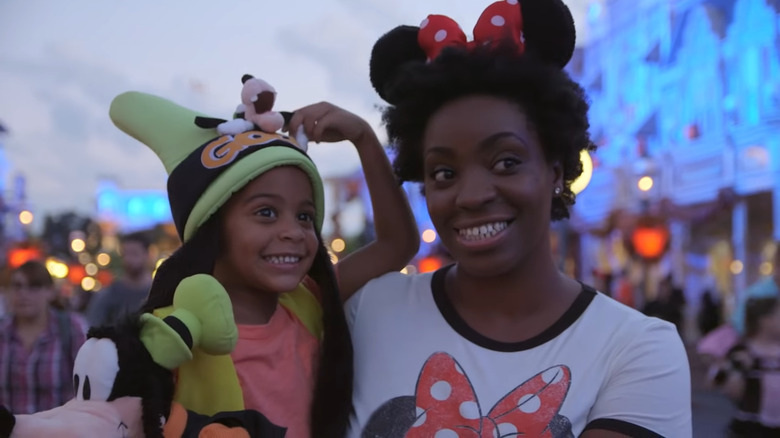 Mom holding child at Disney World