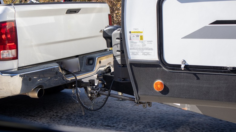 White truck towing an RV