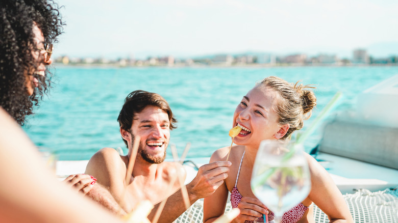 friends laughing on a boat