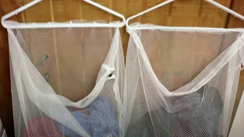 Two mesh laundry bags hanging