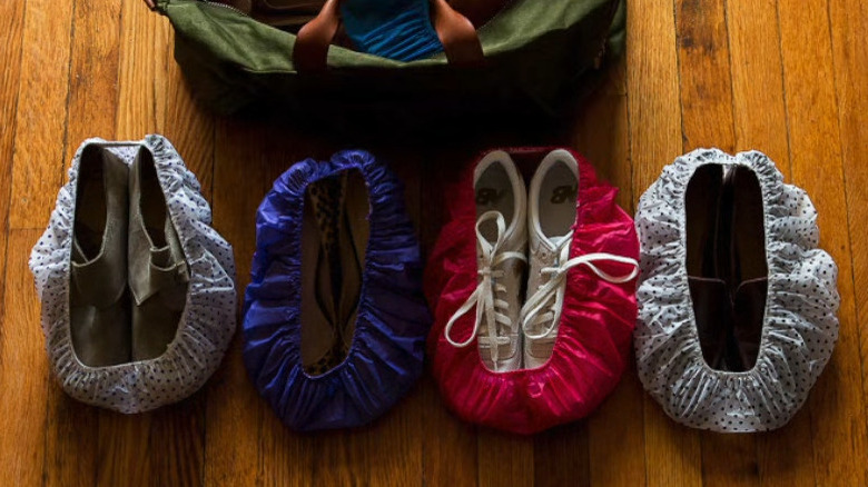 shoes lined up in shower caps