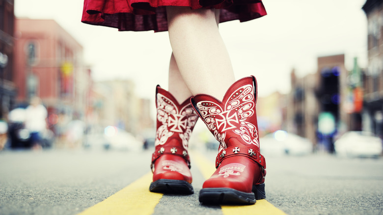 Girls' feet in red cowboy boots