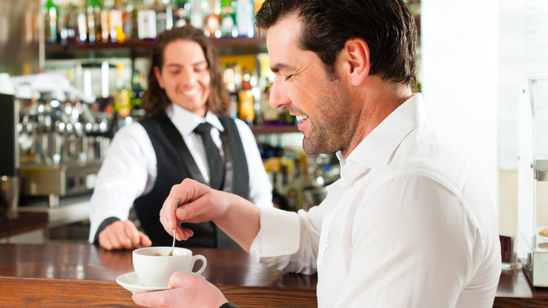 Barista and man with espresso