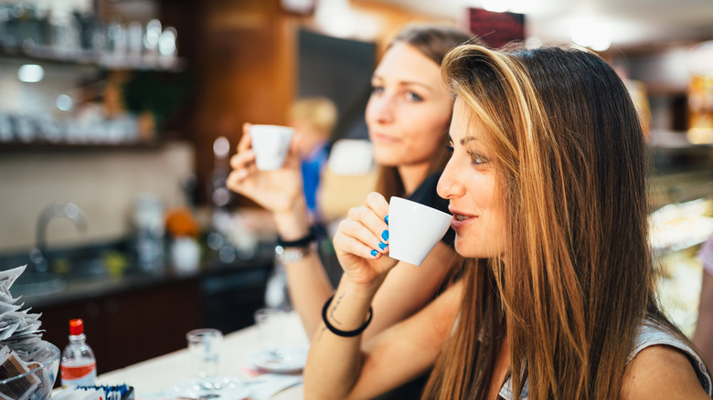 Two women at an espresso bar