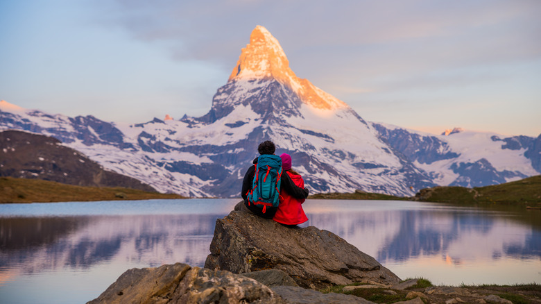 couple in front of mountain peak