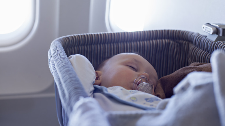 Baby sleeping in bassinet