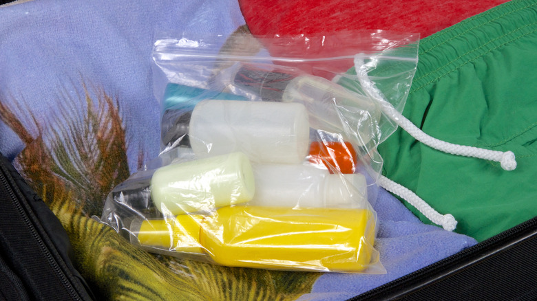 plastic bag with liquids in suitcase