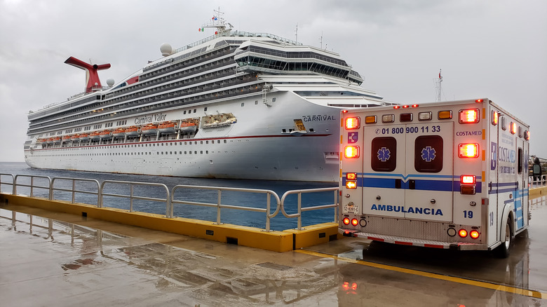 ambulance parked by cruise ship