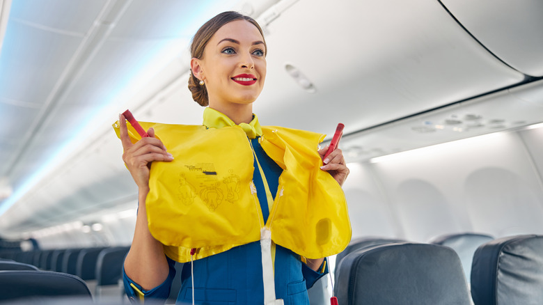 flight attendant with flotation device