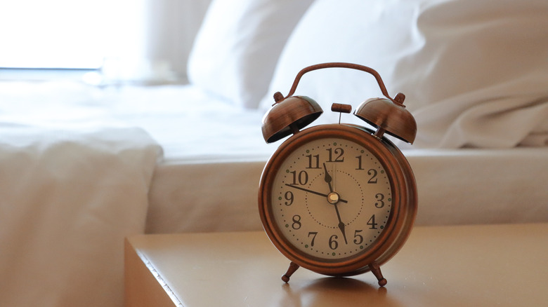 Clock next to hotel bed
