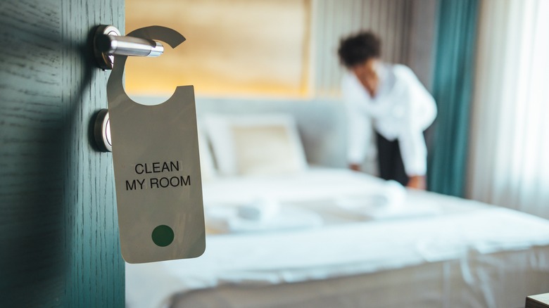 woman cleaning hotel room