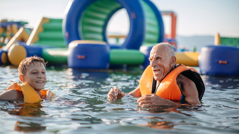 grandpa and grandson at a water park