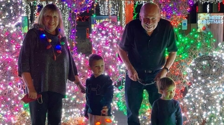 grandparents and grandchildren at a holiday light show