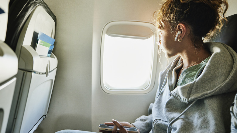 women looking out of plane window