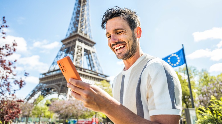 Man using phone in Paris