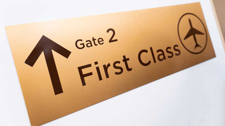 Sign to first-class airline boarding