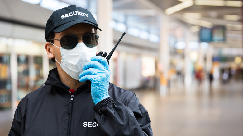 Airport security man with walkie talkie