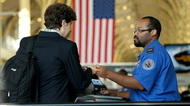 TSA officer checking travel documents