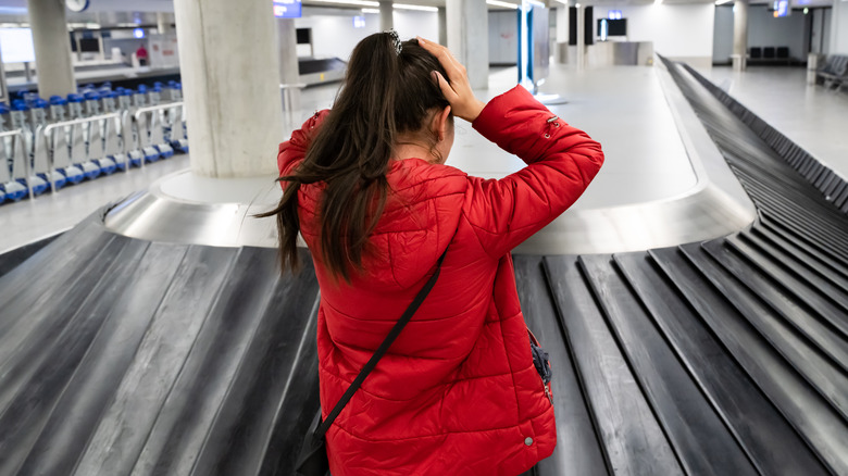 Woman losing checked baggage