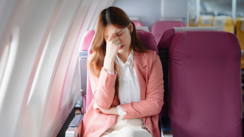 frustrated woman on plane