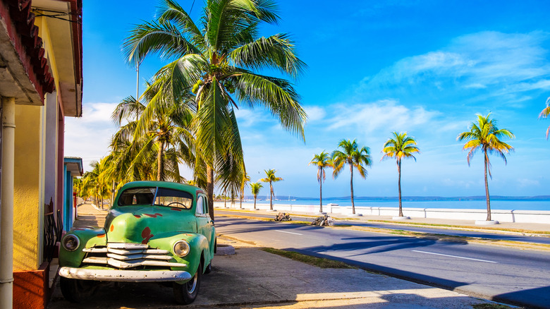 Old car by the beach in Cienfuegos