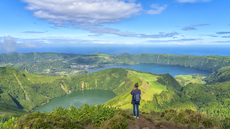 Traveler standing at viewpoint of São Miguel