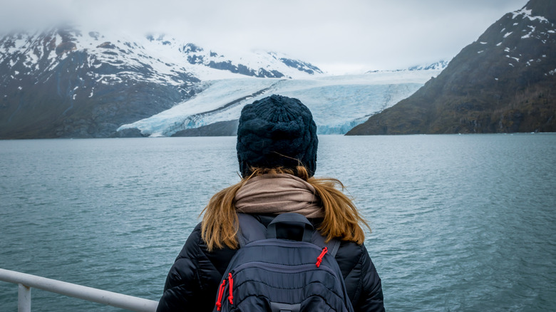 Traveler watching Portage Glacier from cruise