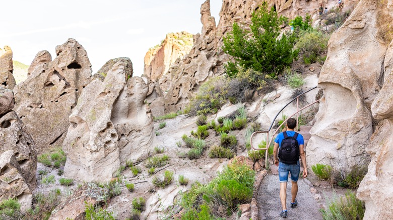 man hiking Bandelier 