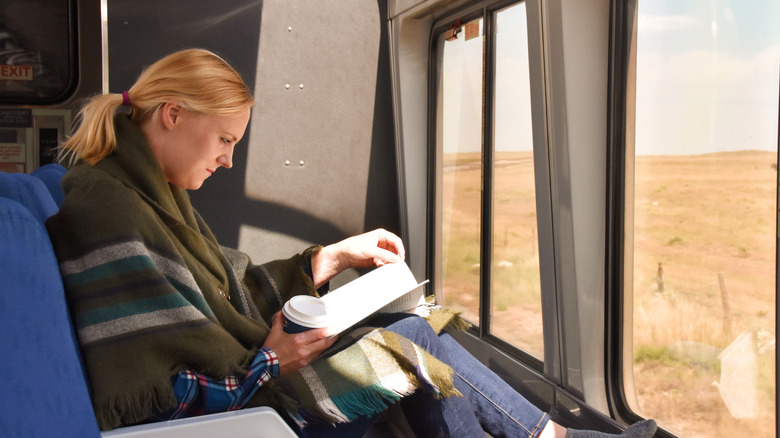 Woman reading on train