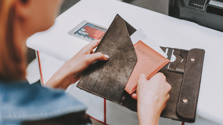 Woman with passport wallet