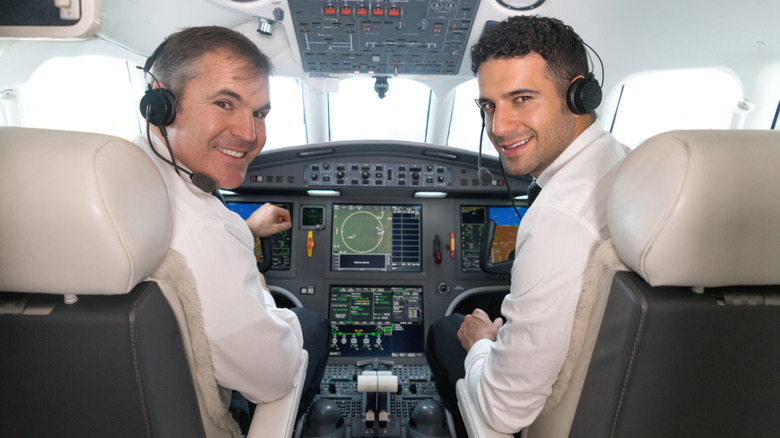 Pilot and co-pilot in cockpit