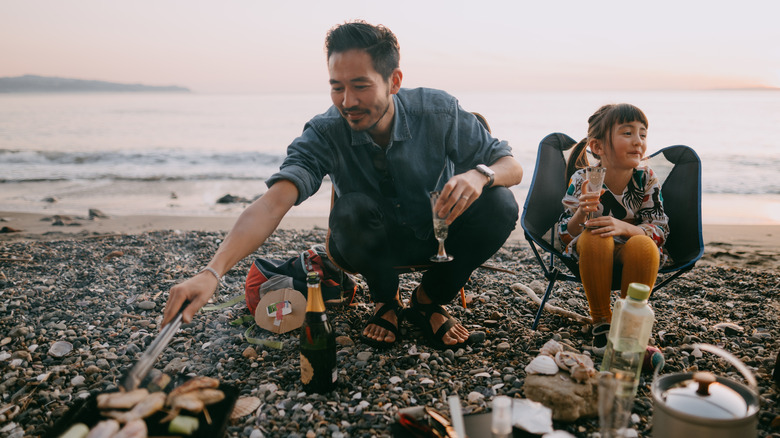 Camping family cooking together