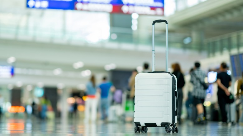 single suitcase left alone in an airport