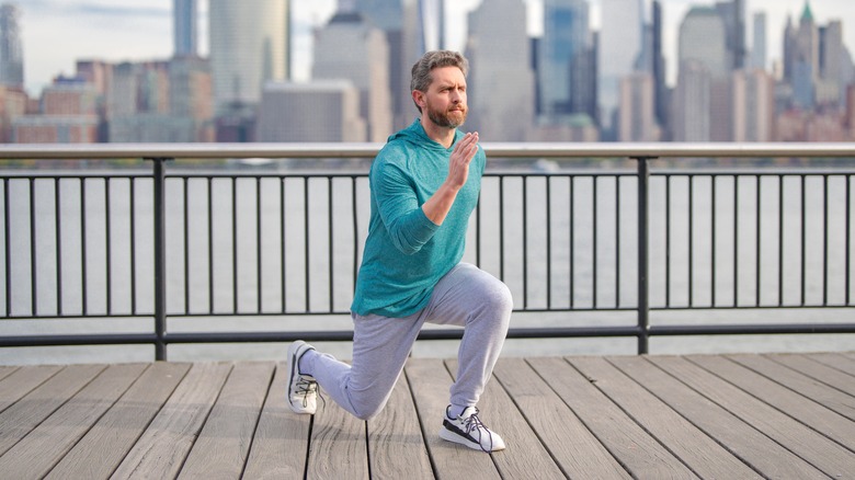 man exercising with Manhattan skyline