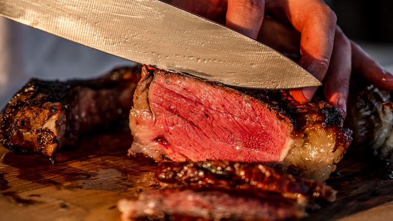 A steak being cut 