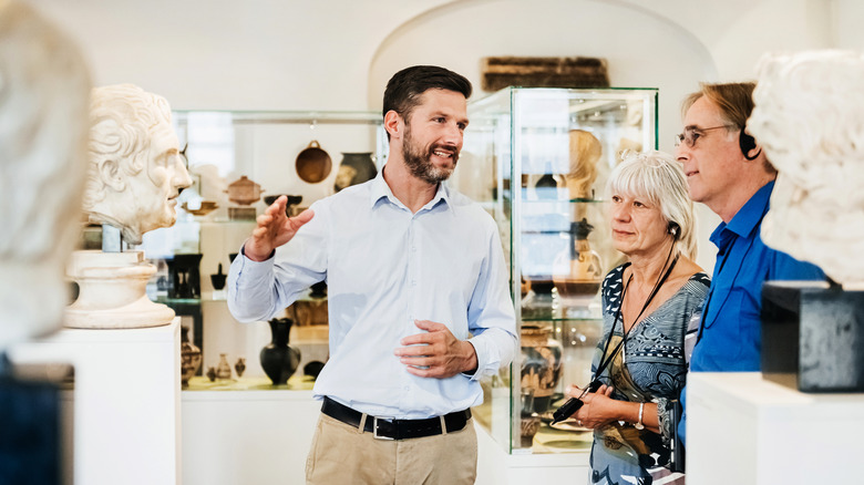 Curator discussing art with visitors