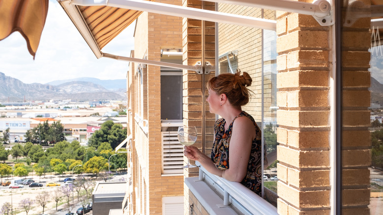 woman looking out a window