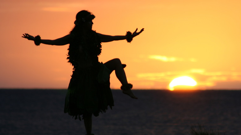 hula dancer at sunset