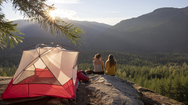 People camping on a hilltop 