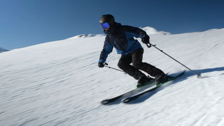 A skier initiating a carve