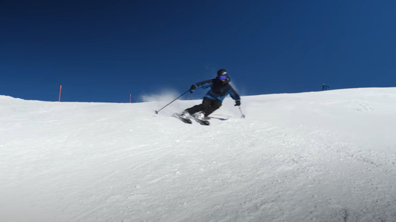 Skier performing a carved turn