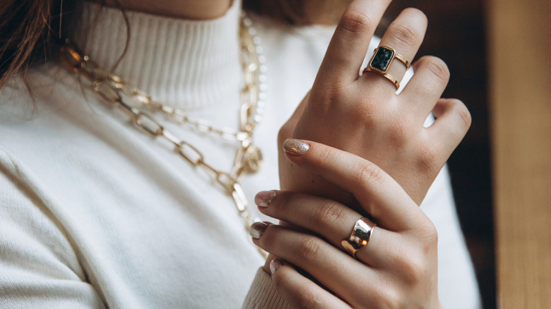 Woman wearing elegant gold jewelry