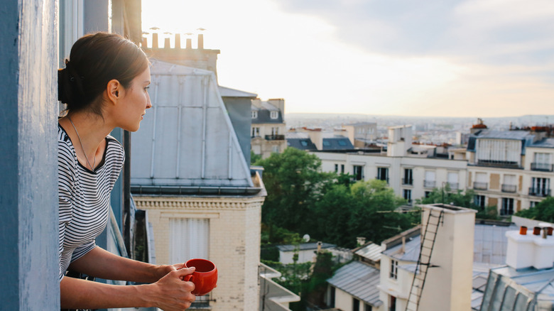 Woman looking over European city