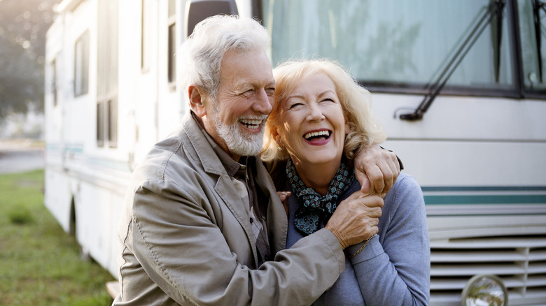 Elderly couple outside an RV