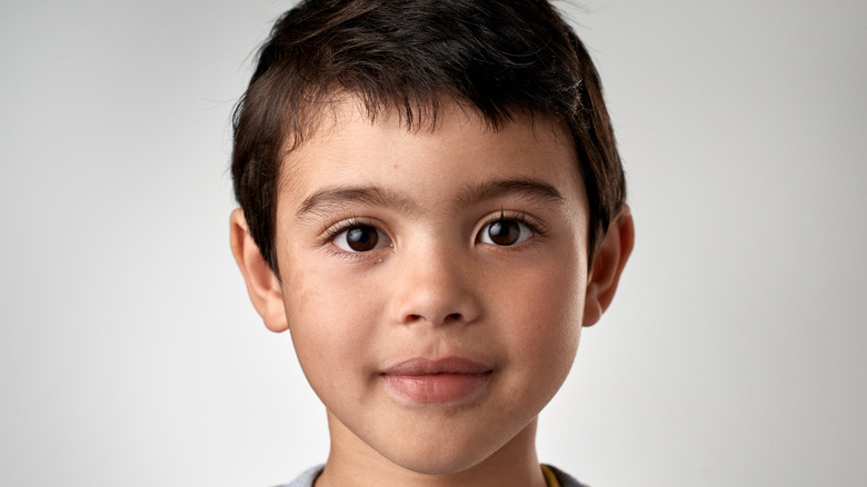 Child posing for passport photo