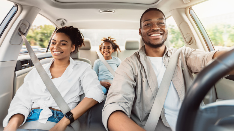 Happy family in rental car